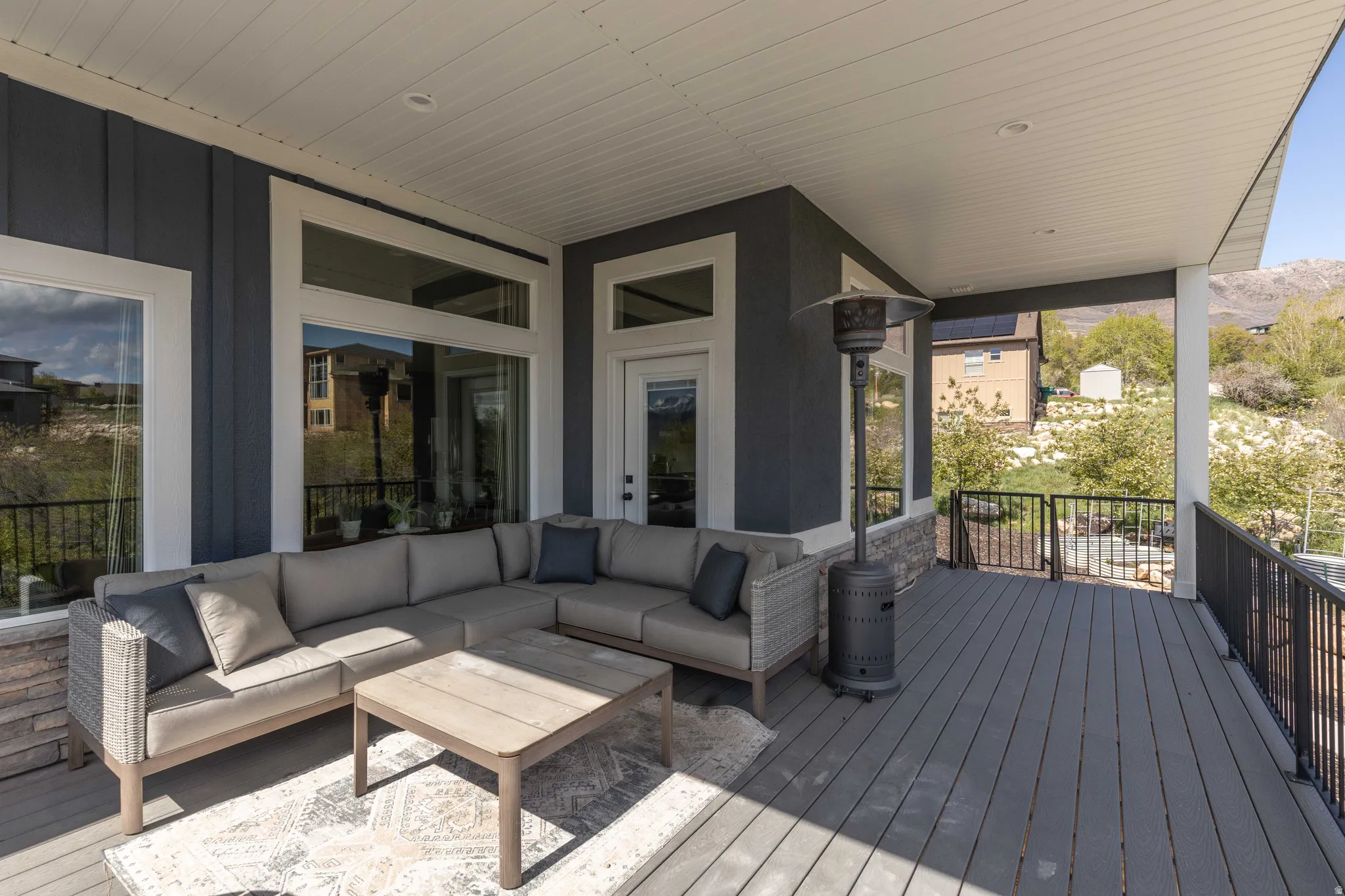 Wooden terrace featuring an outdoor lounge area