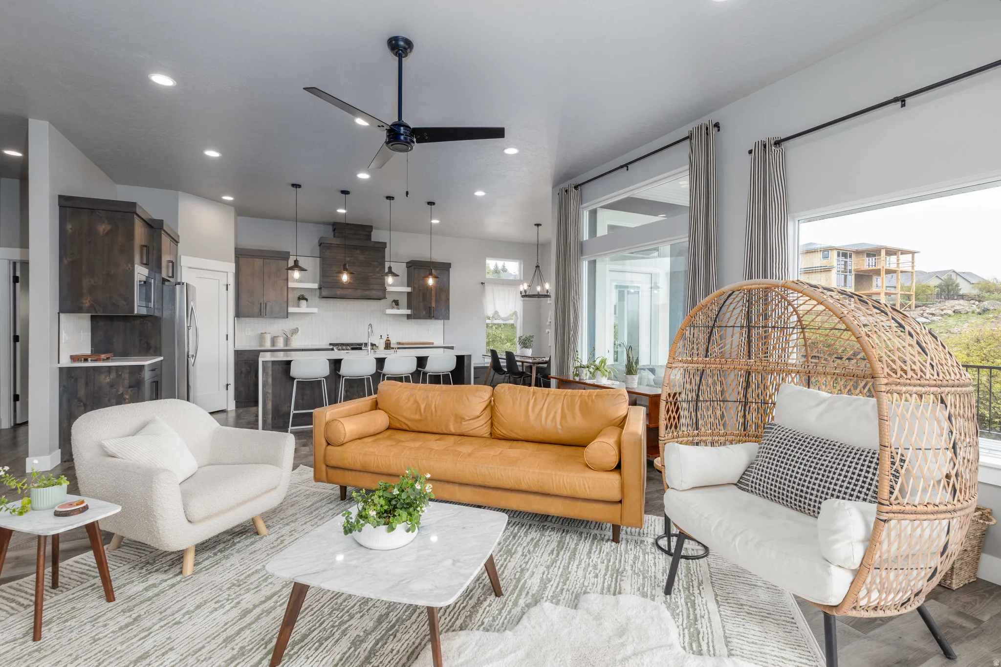 Living room with ceiling fan and recessed lighting
