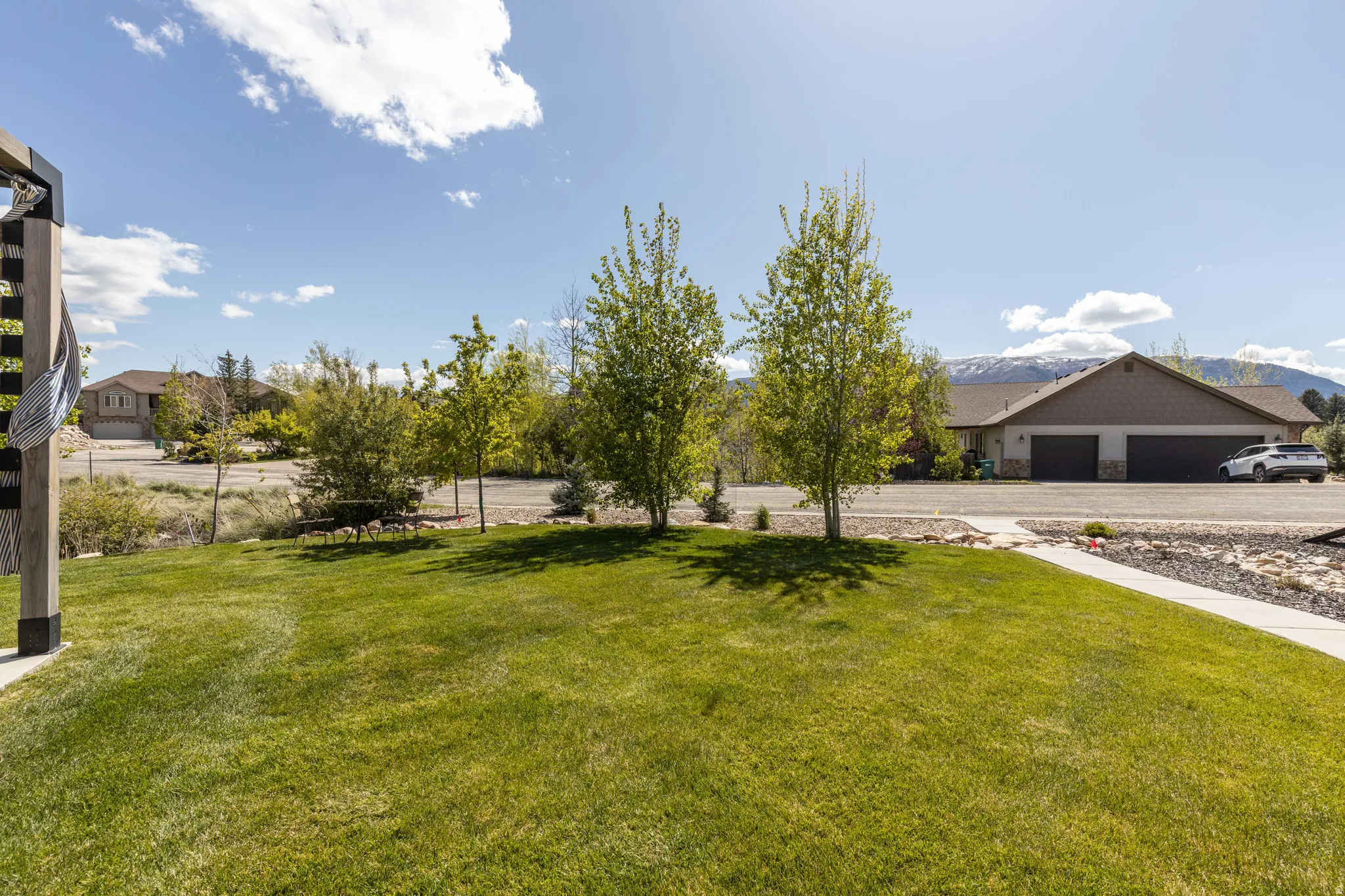 View of grassy yard featuring a mountain view