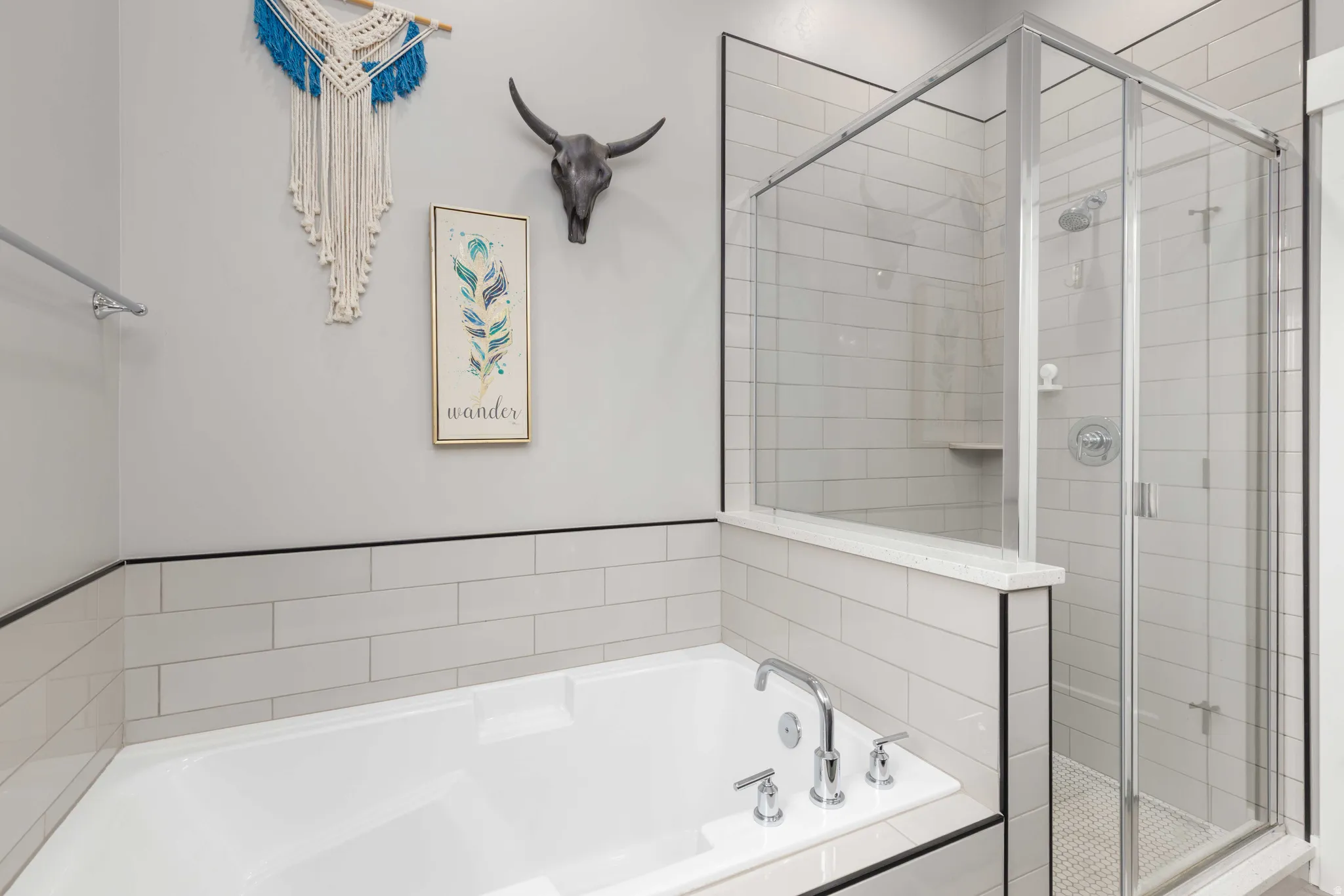 Full bathroom featuring a stall shower and a bath