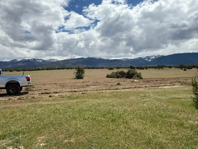 View of mountain background featuring rural landscape