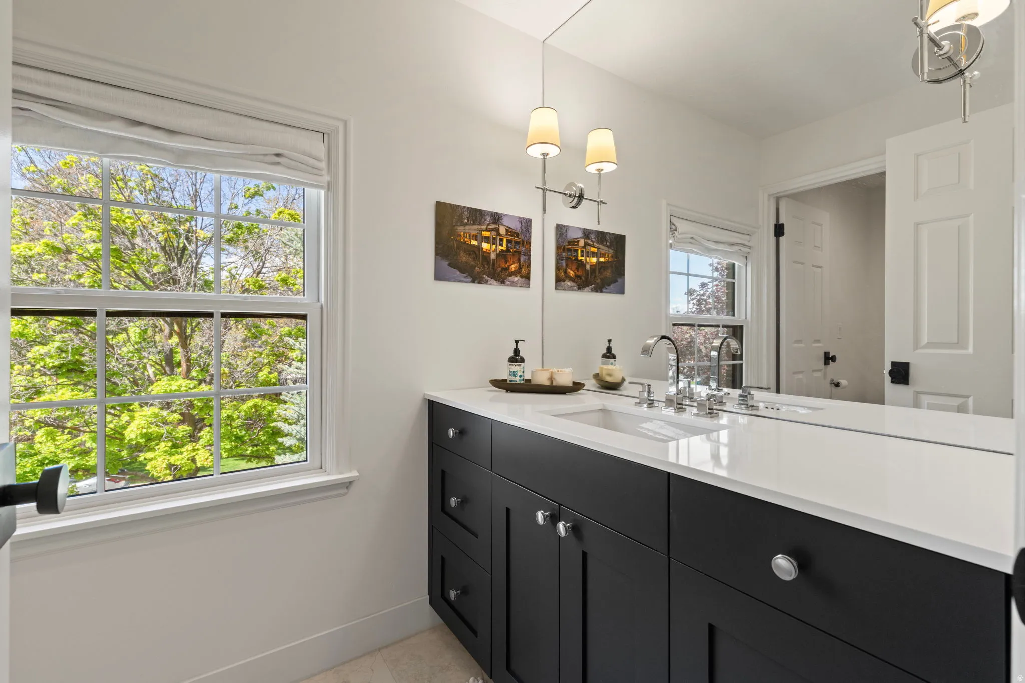 Bathroom featuring vanity and light tile patterned floors