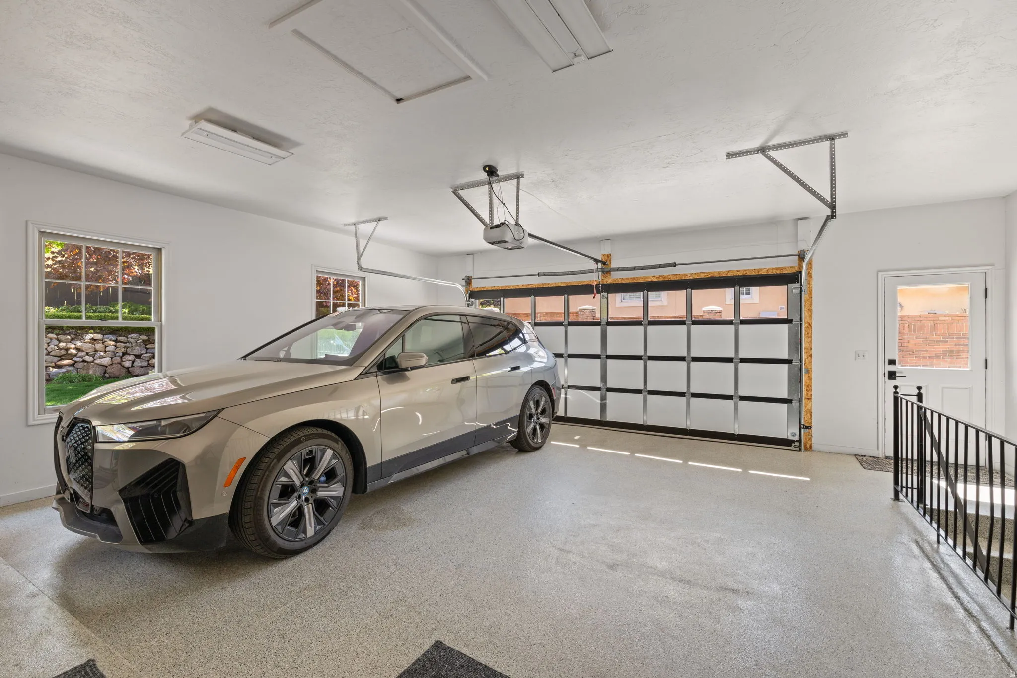 Garage featuring baseboards