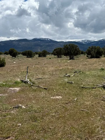 View of mountain background featuring rural landscape