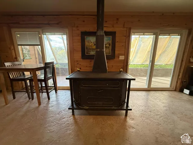 Detailed view of a wood stove and wooden walls