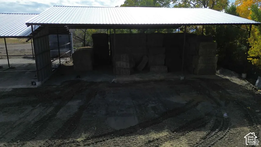 View of parking featuring a carport