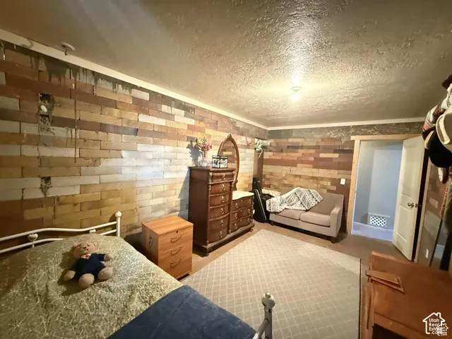 Bedroom featuring a textured ceiling
