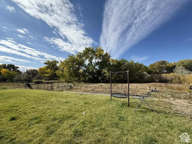 View of green lawn featuring a view of rural / pastoral area