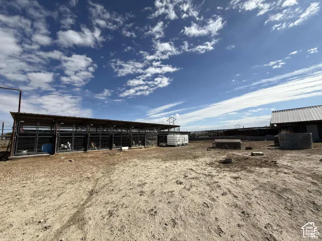 View of yard featuring an outbuilding and an exterior structure