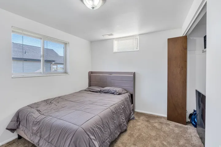 Bedroom with carpet and baseboards