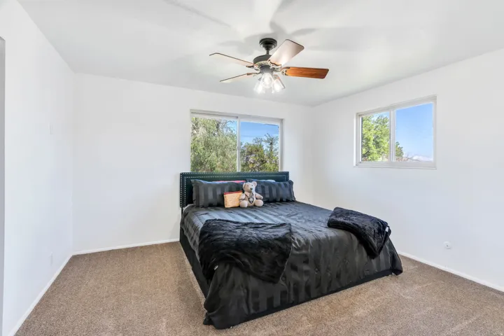 Bedroom with carpet floors and ceiling fan