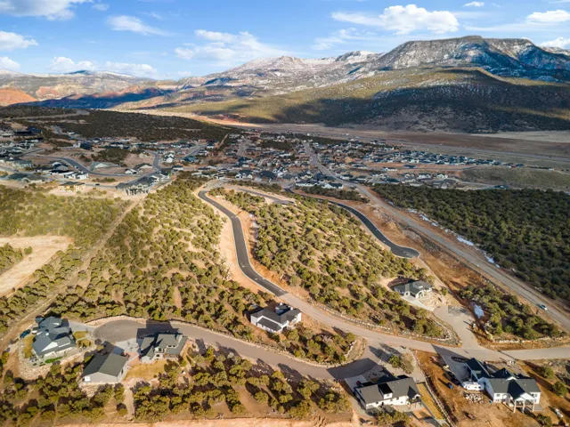 Aerial perspective of suburban area with a mountainous background