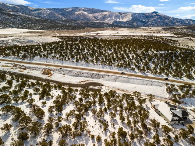 Snowy aerial view featuring a mountain view