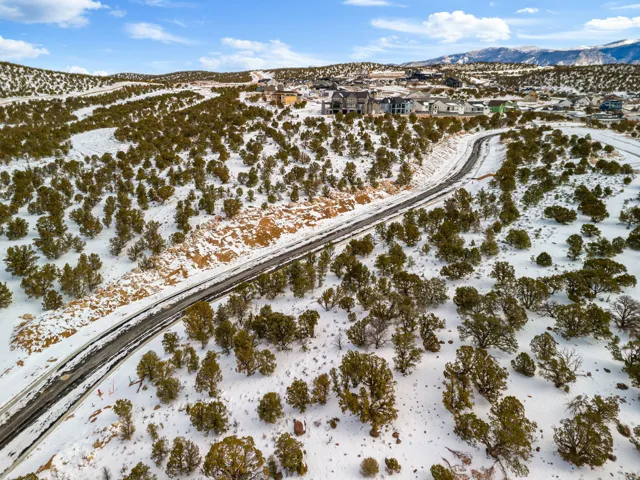 Snowy aerial view featuring a mountain view