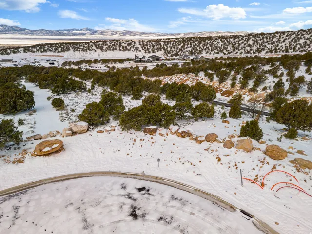 Snowy aerial view featuring a mountain view