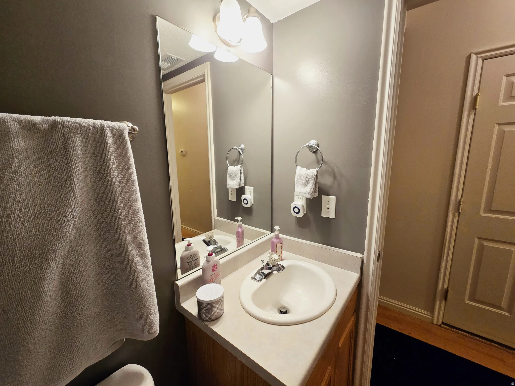 Half bath with vanity and toilet