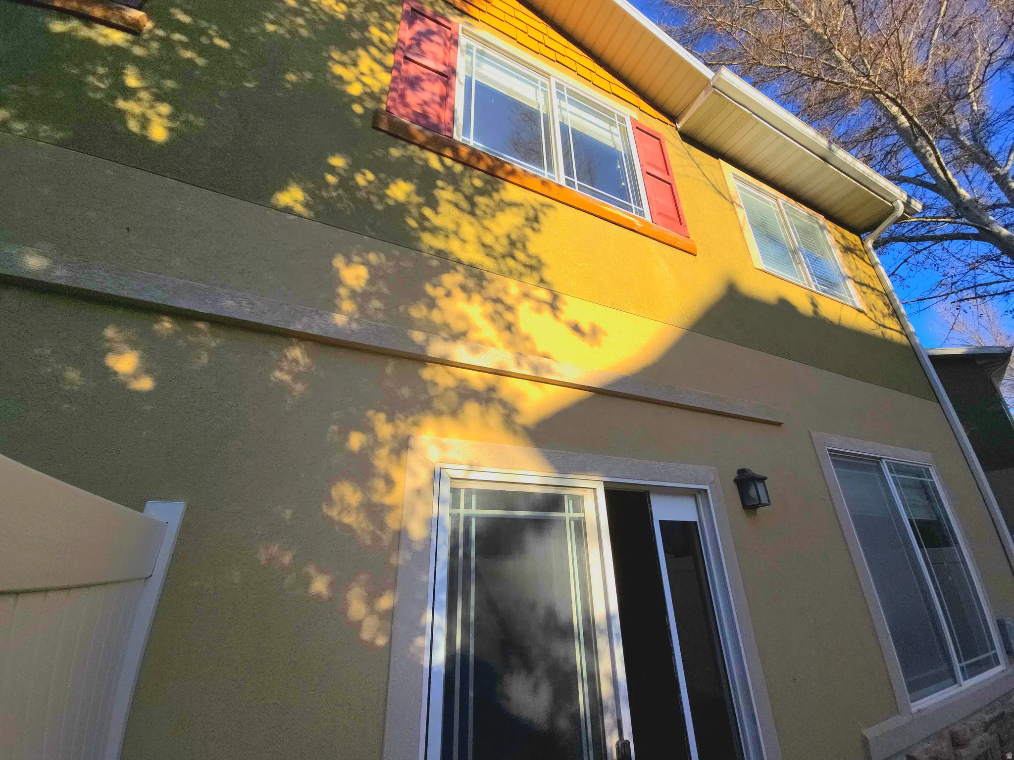 View of property exterior with stucco siding