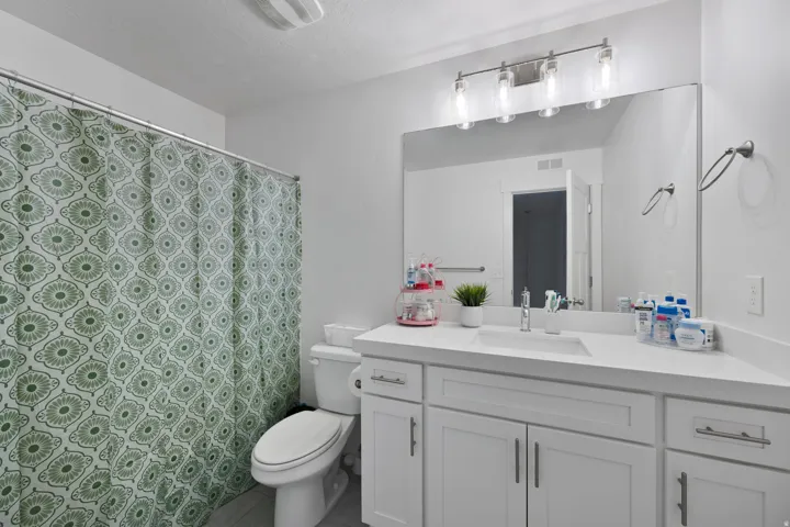 Full bathroom featuring vanity and a shower with curtain