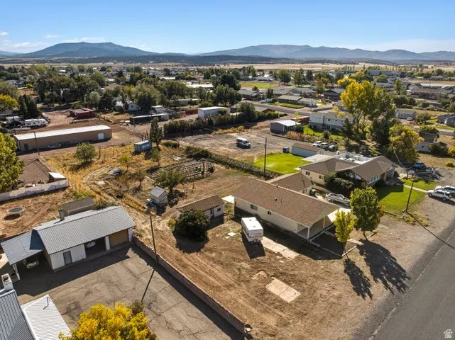 Aerial view of residential area featuring a mountain backdrop