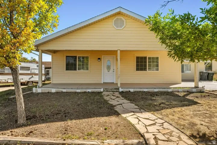 View of front of house with covered porch