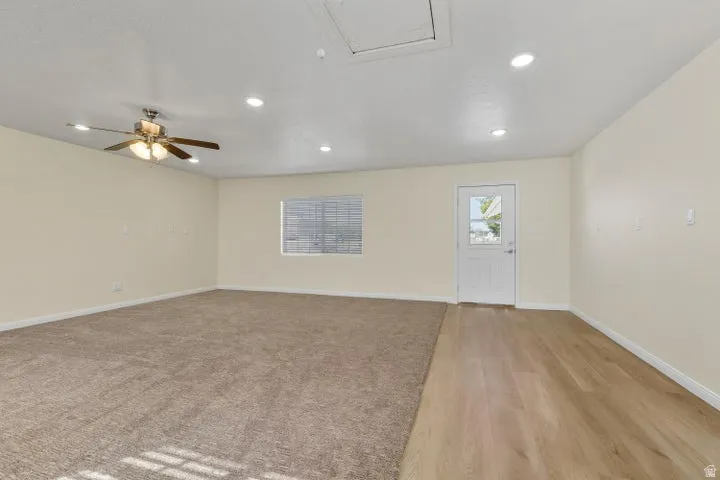 Spare room with ceiling fan, recessed lighting, and light wood finished floors