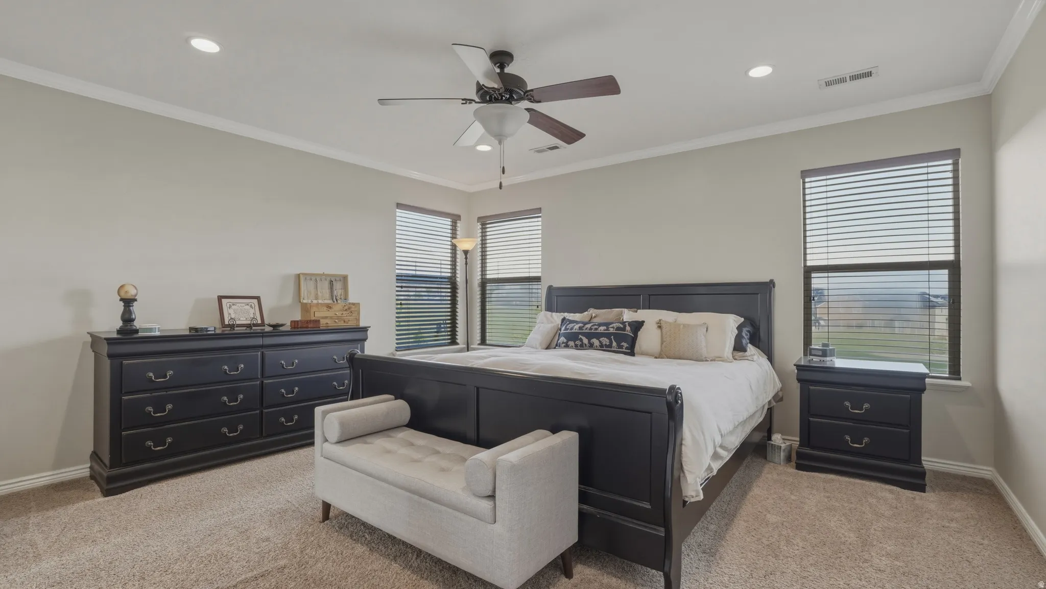 Bedroom with carpet, ornamental molding, ceiling fan, and recessed lighting