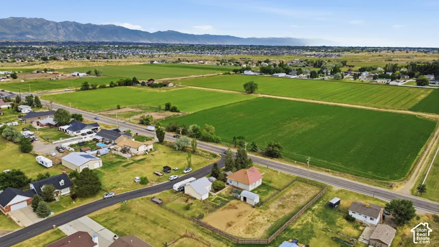 Expansive fields and agricultural land with distant mountain ranges