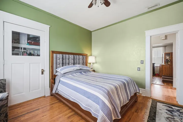 Hardwood flooring throughout, framed by classic white trim