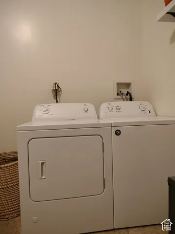 Laundry area with washing machine and clothes dryer