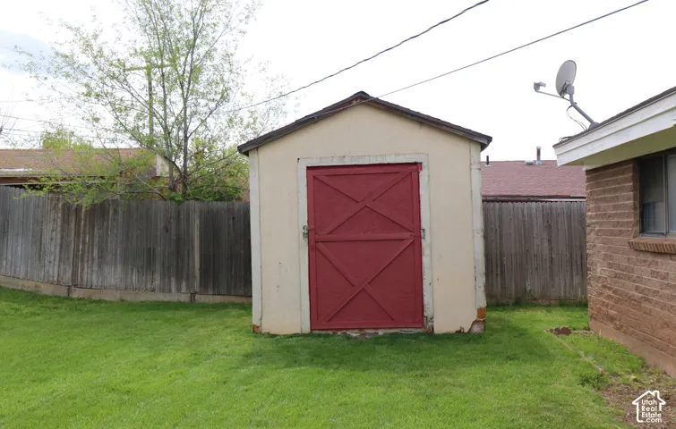 View of shed featuring a fenced backyard