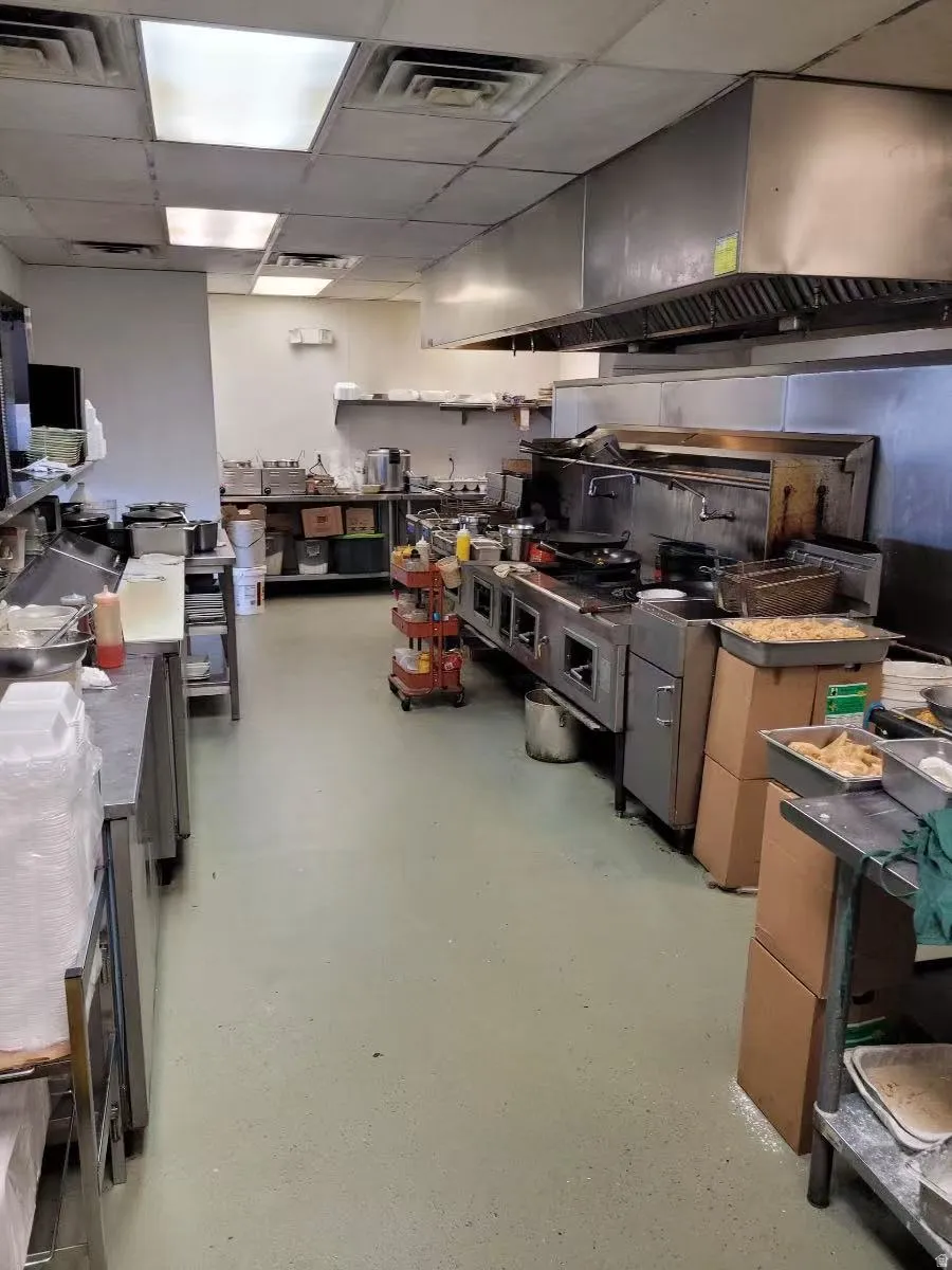 Kitchen with range hood and a drop ceiling