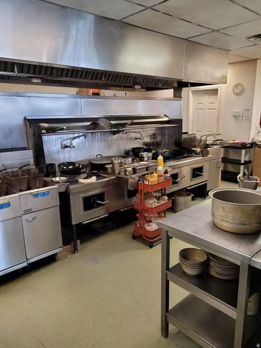 Kitchen featuring extractor fan and a paneled ceiling