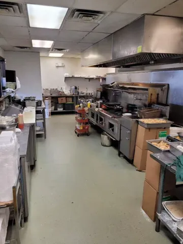 Kitchen with range hood and a drop ceiling