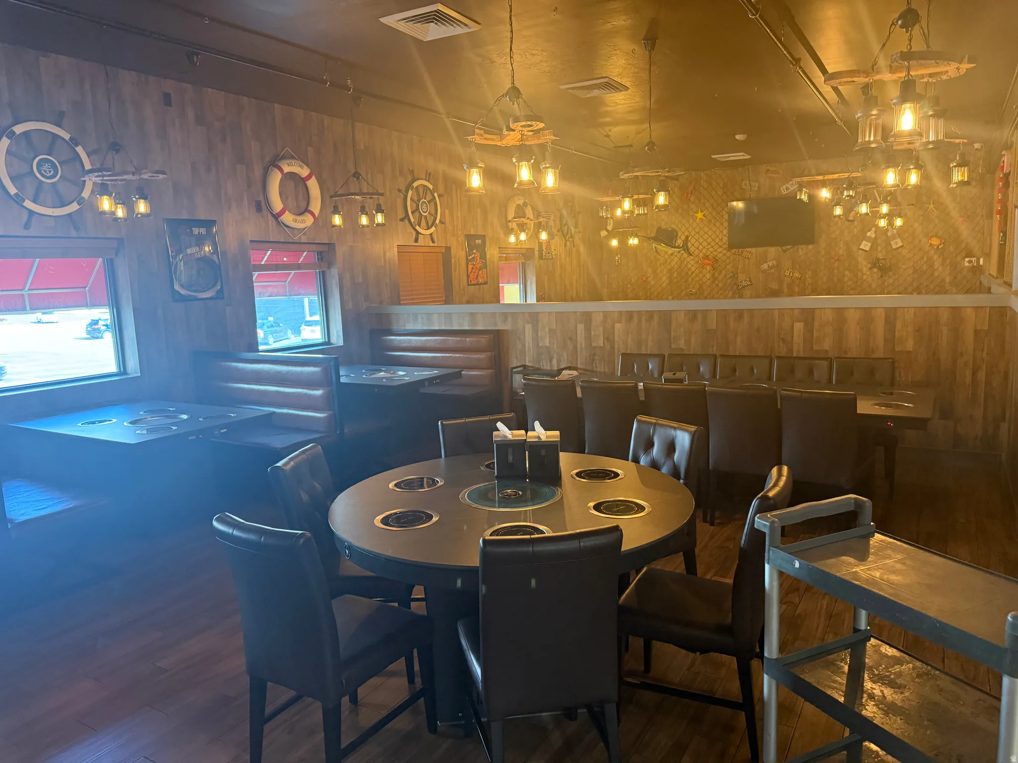 Dining room featuring wood walls and wood finished floors