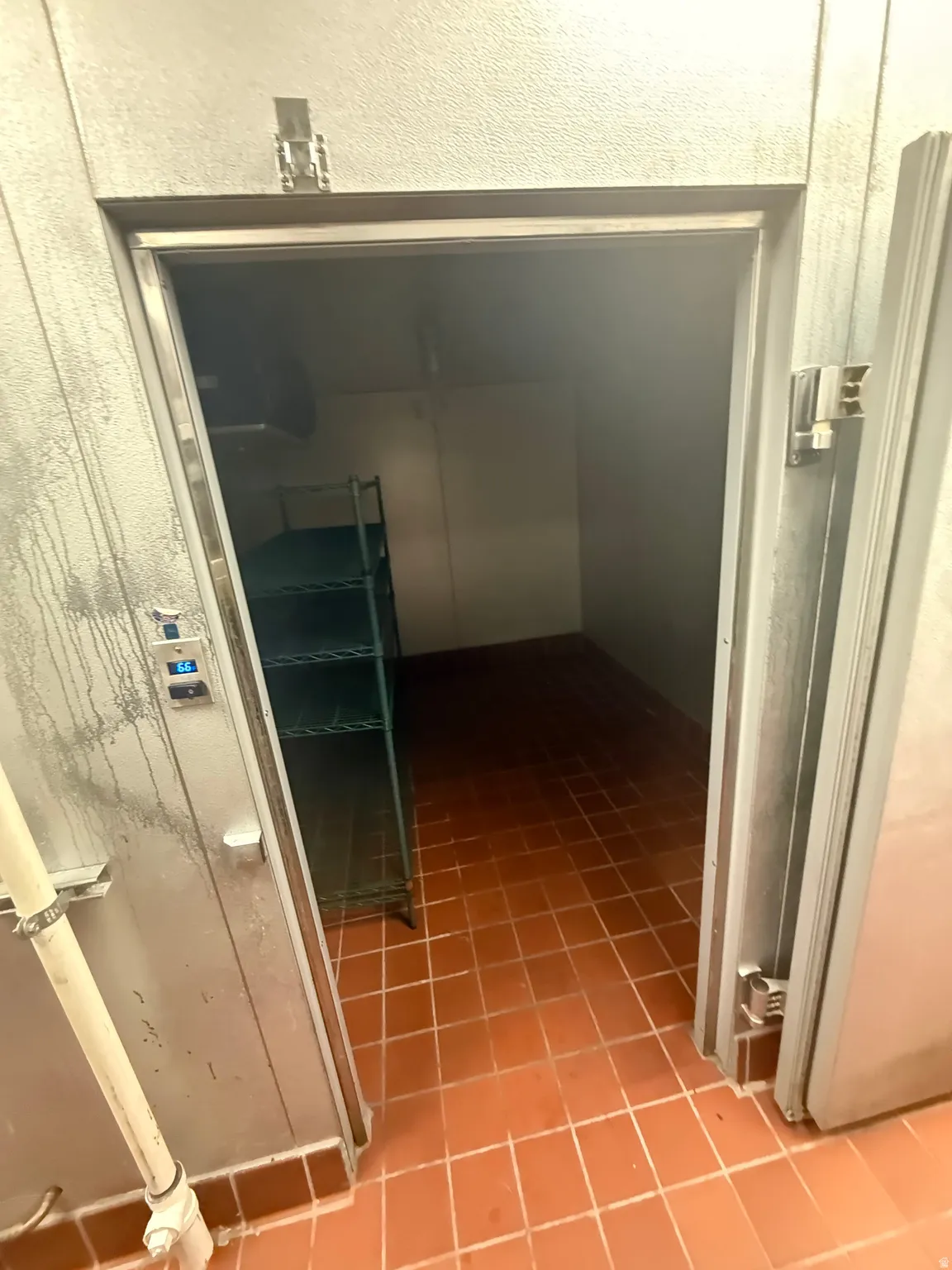 Corridor with light tile patterned floors