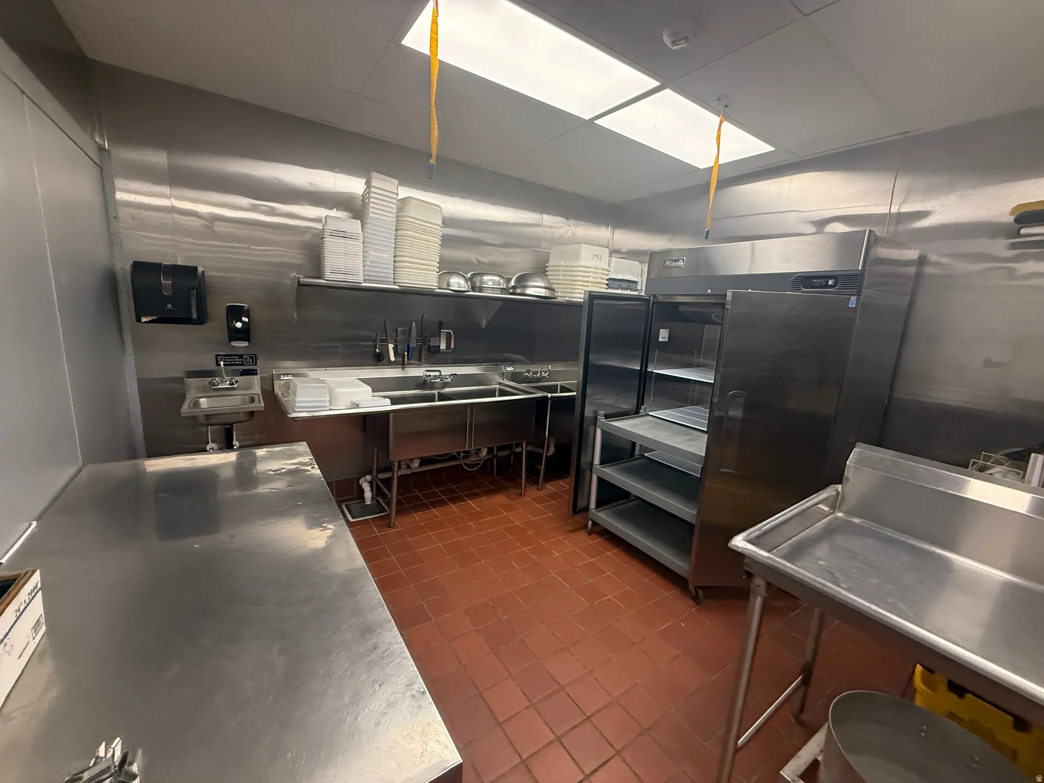 Kitchen with stainless steel countertops and a sink