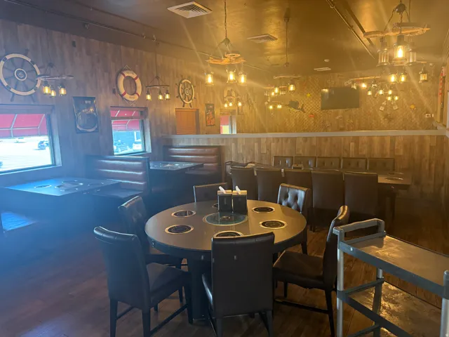 Dining room featuring wood walls and wood finished floors