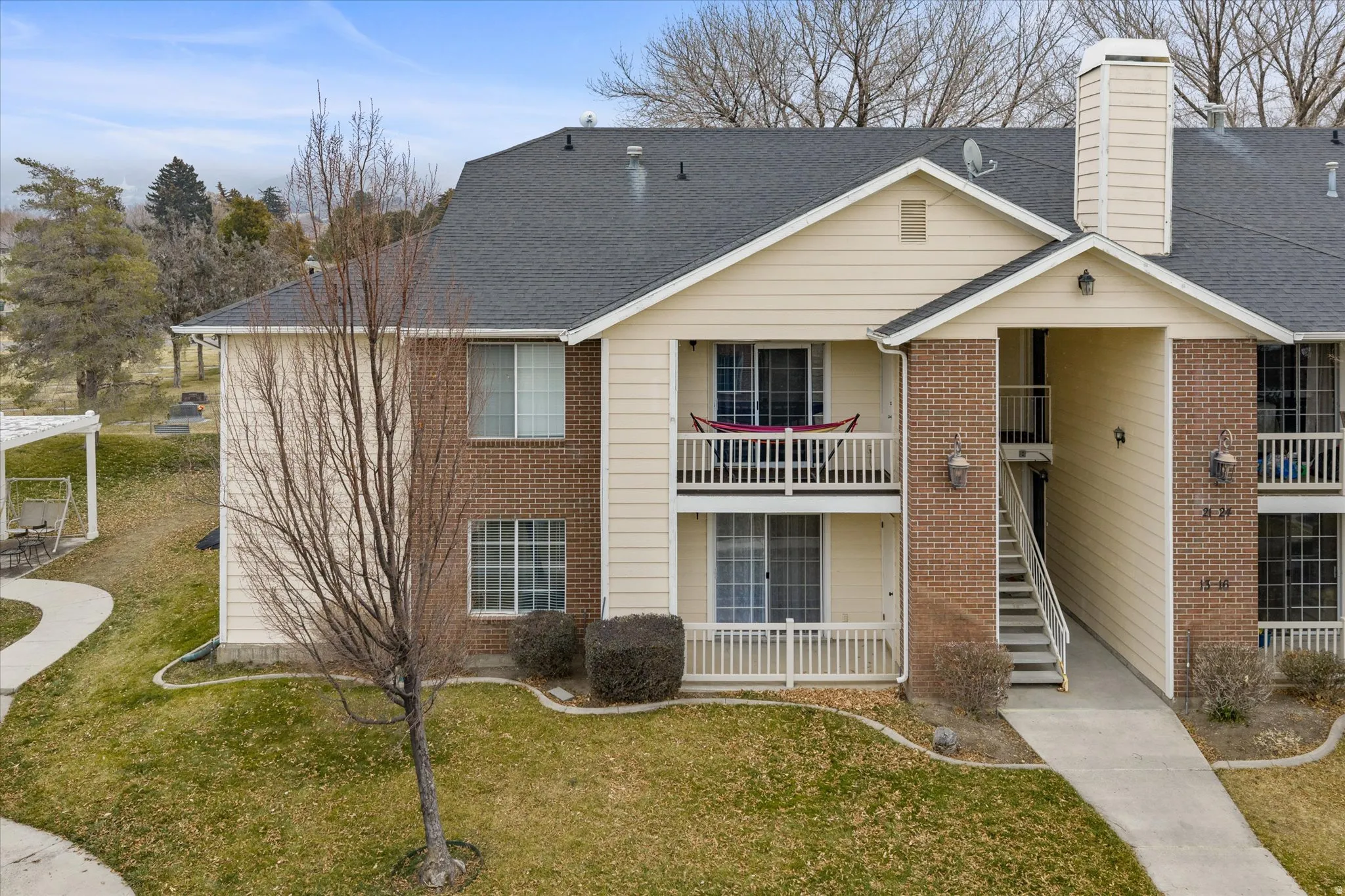 View of property with stairs