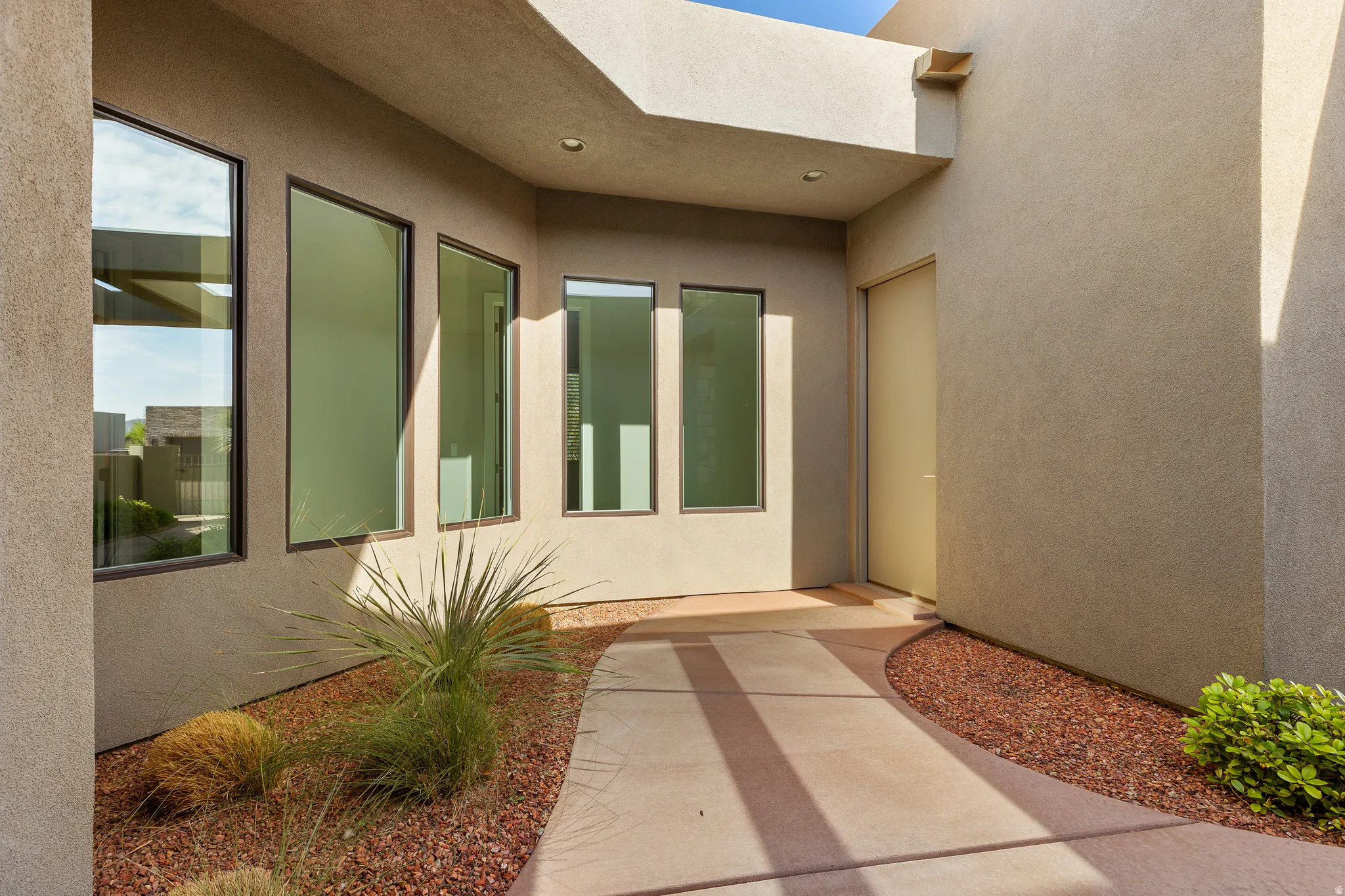 Doorway to property with stucco siding