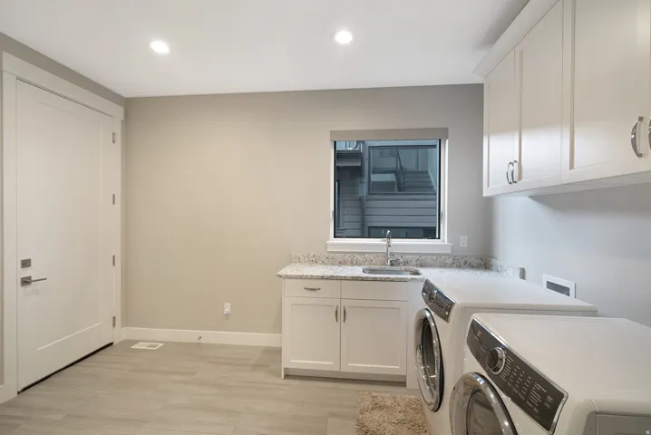 Fantastic Tiled Laundry Room with Sink, Washer/Dryer Included