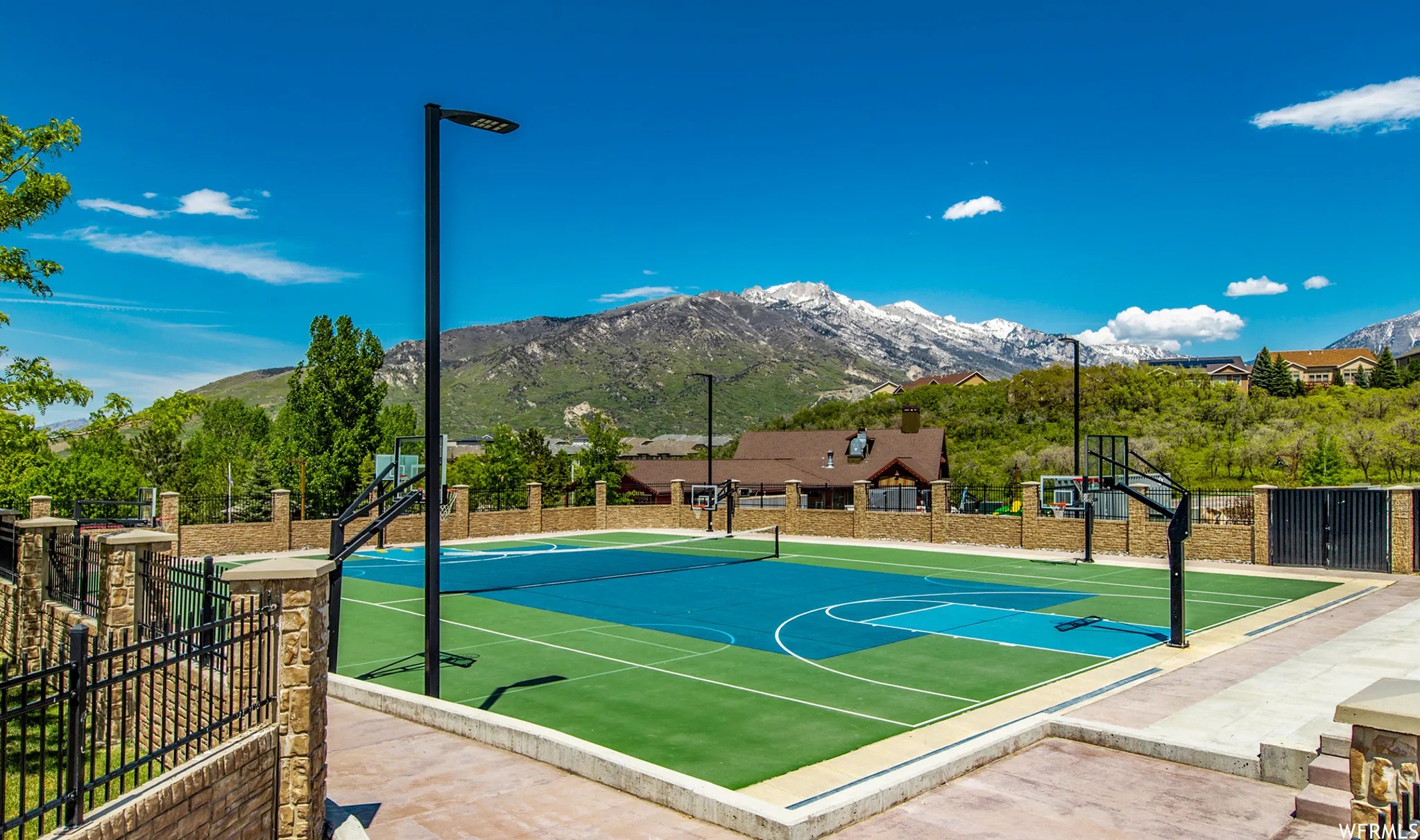View of basketball court featuring a mountain view and community basketball court