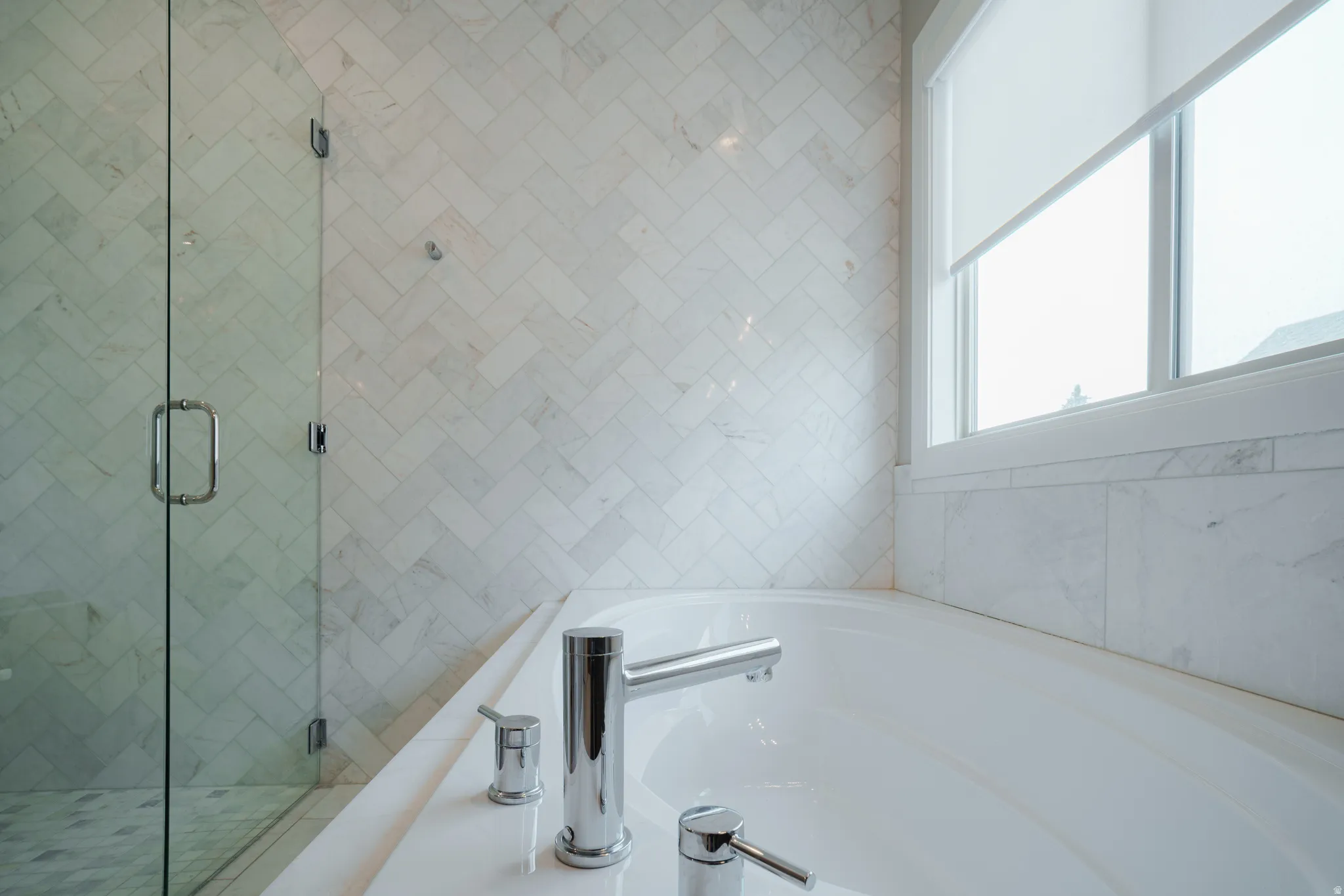 Bathroom with a garden tub and a shower stall
