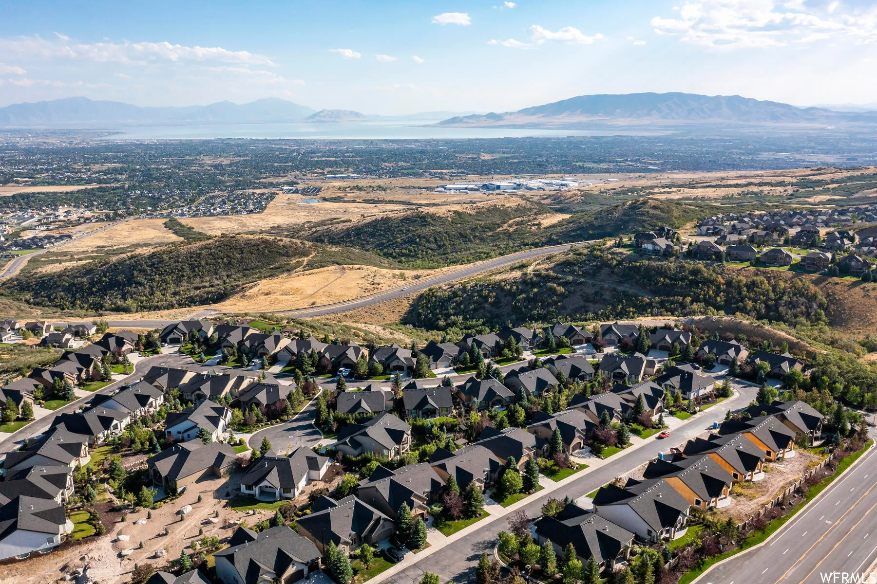 Aerial perspective of suburban area featuring a mountain backdrop