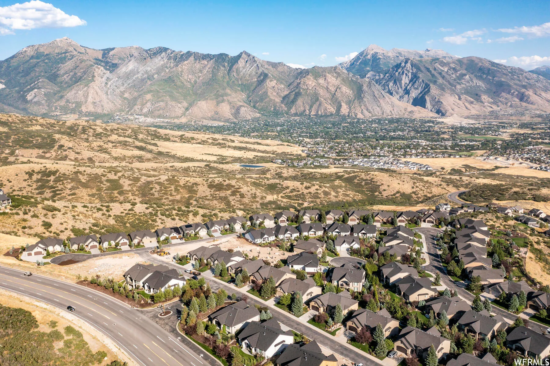 View of mountain background featuring nearby suburban area