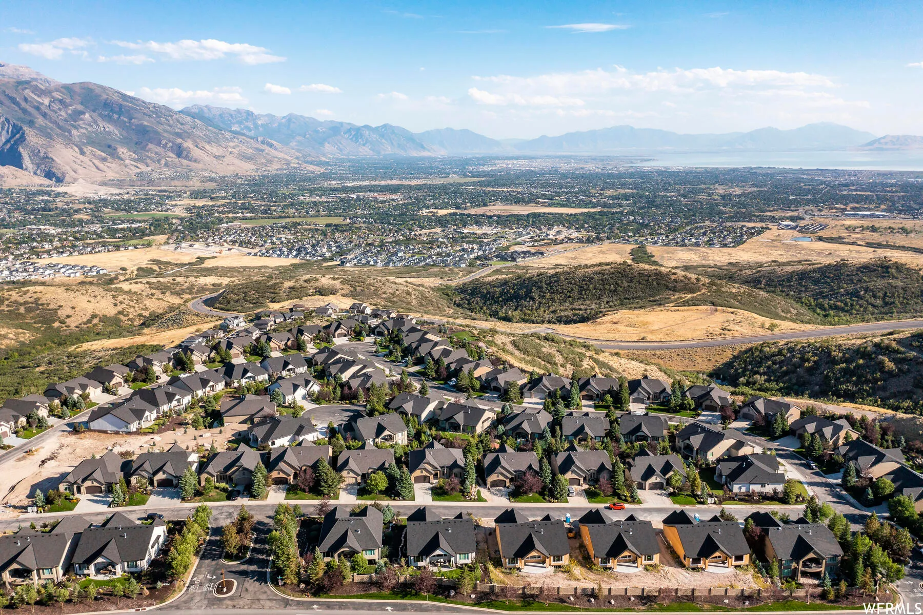 Aerial view of residential area featuring mountains