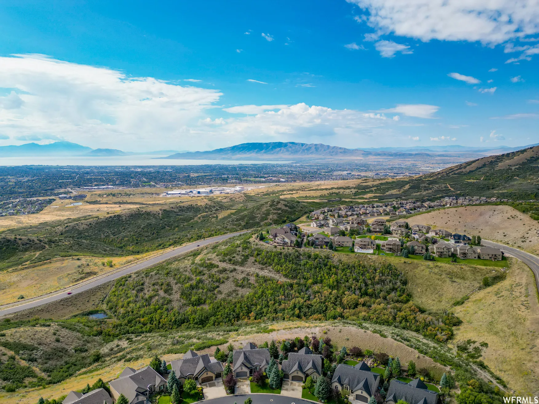 Aerial view of residential area featuring a mountainous background