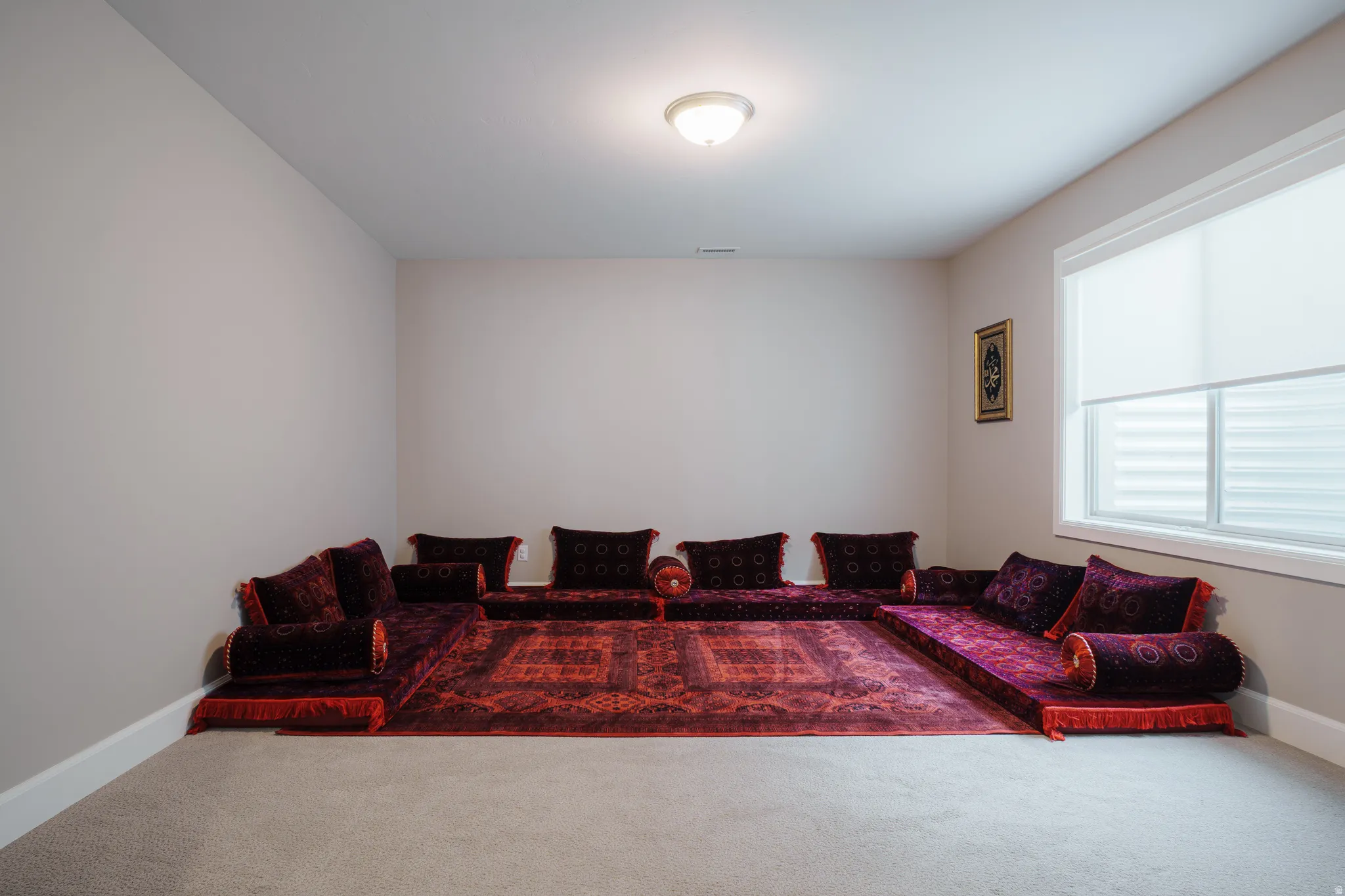 Living room featuring carpet floors and baseboards