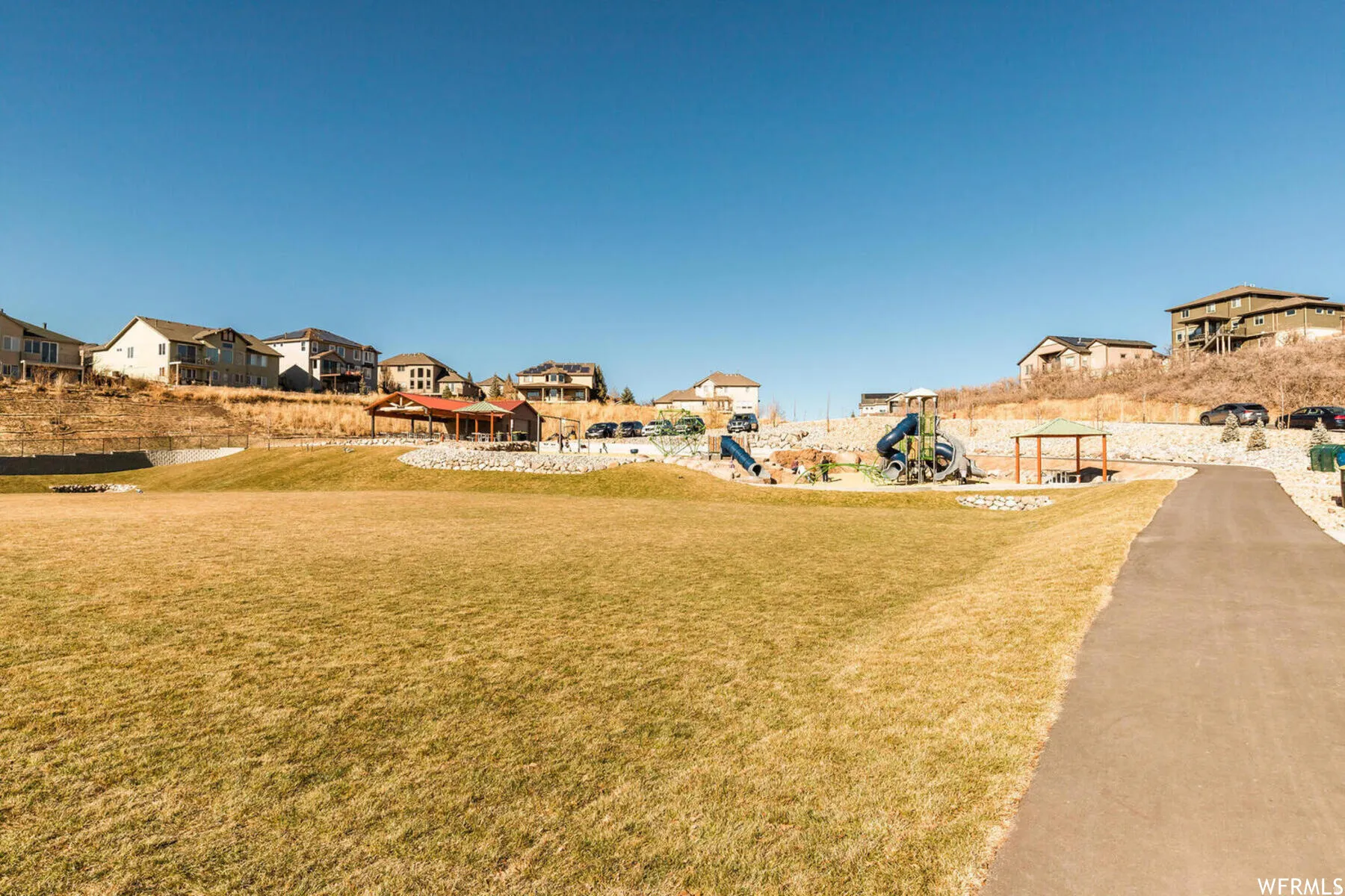 View of grassy yard featuring a residential view and a gazebo