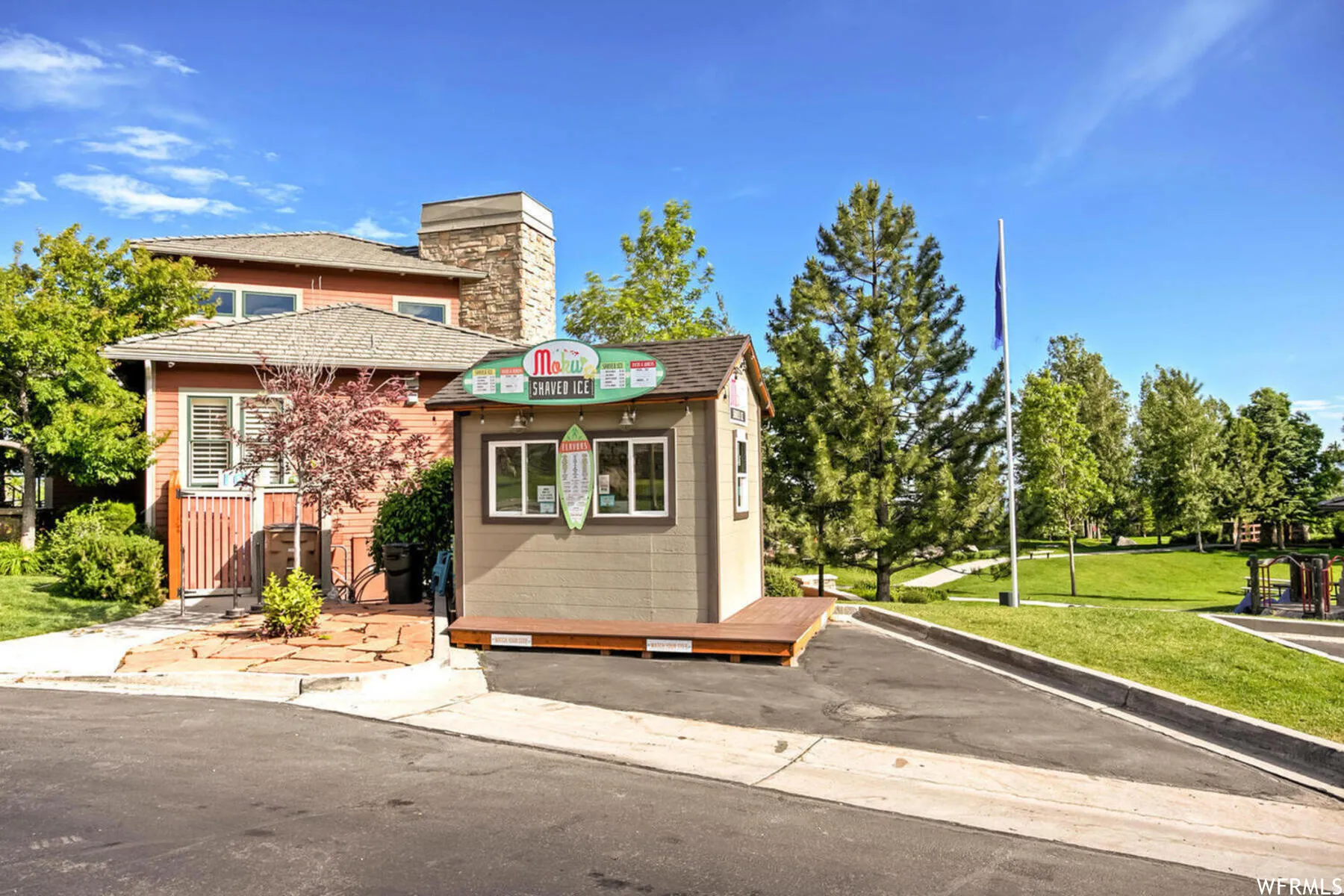 Bungalow featuring a front yard and a chimney