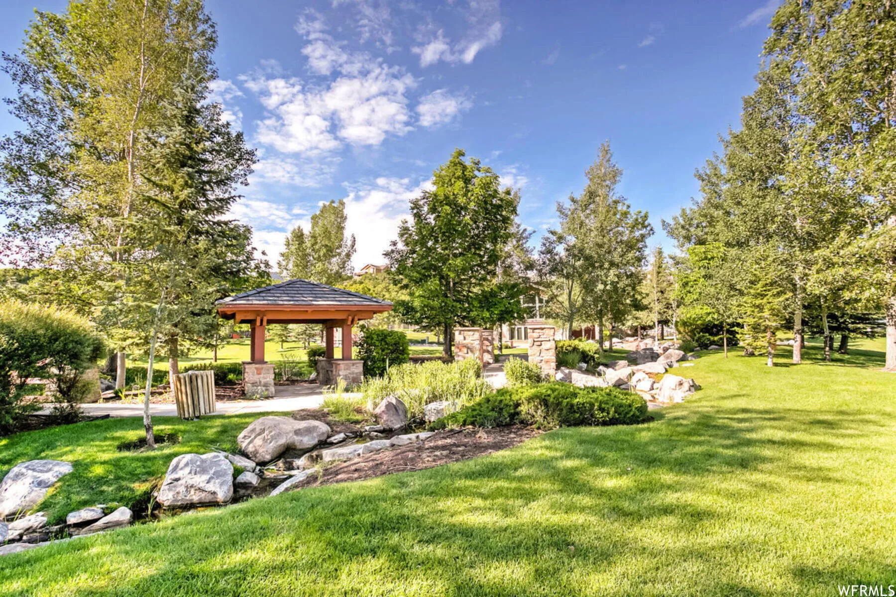 View of grassy yard featuring a gazebo